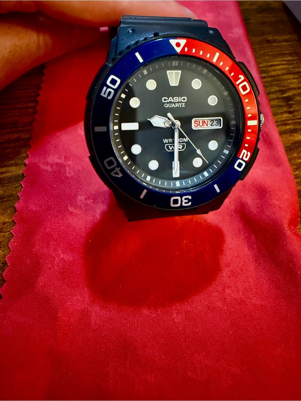 Casio GMT Black Dial Watch with Blue and Red Bezel